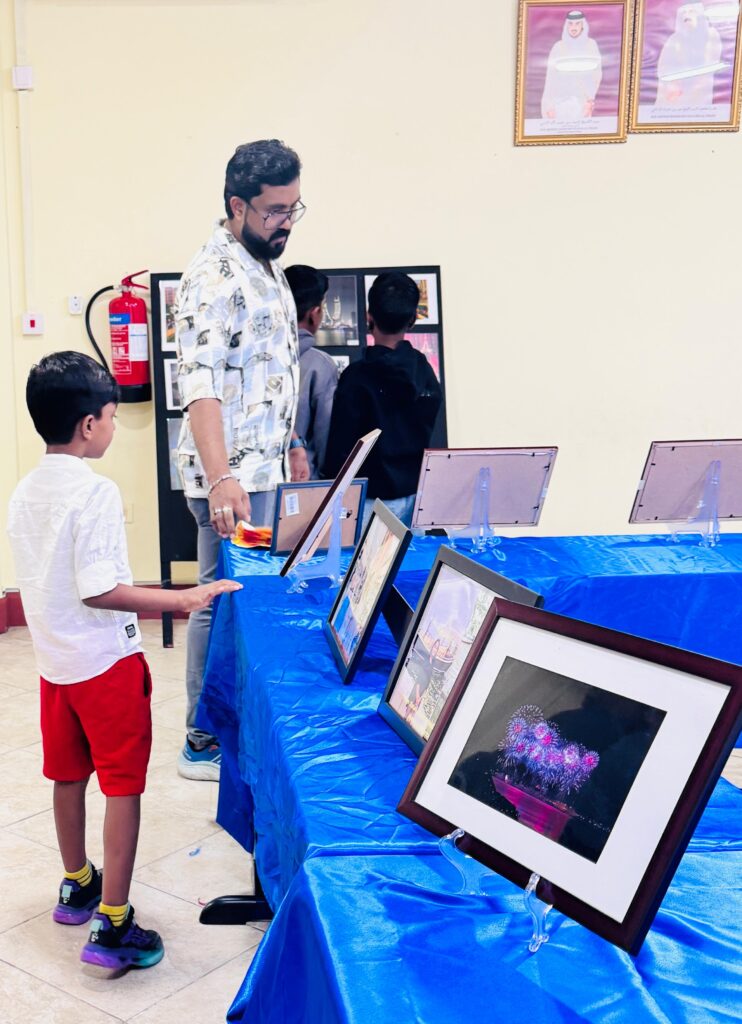 Students and parents viewing photography exhibition at Pearl School Al Dafna