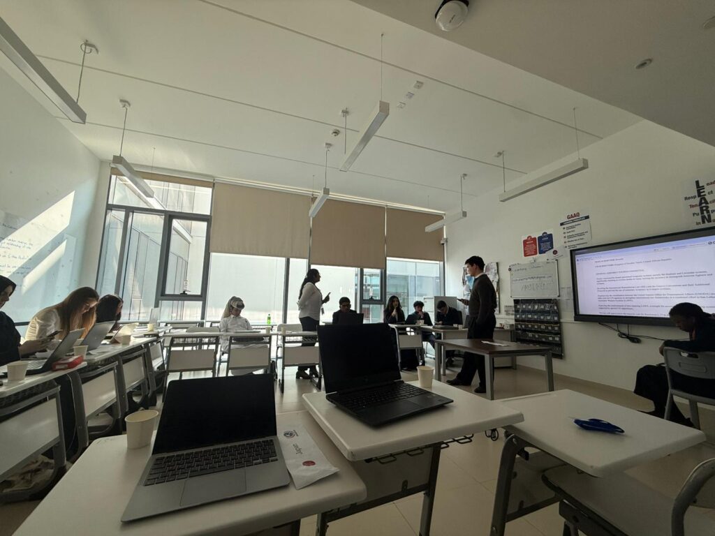 Delegates discussing global issues at GAAQMUN