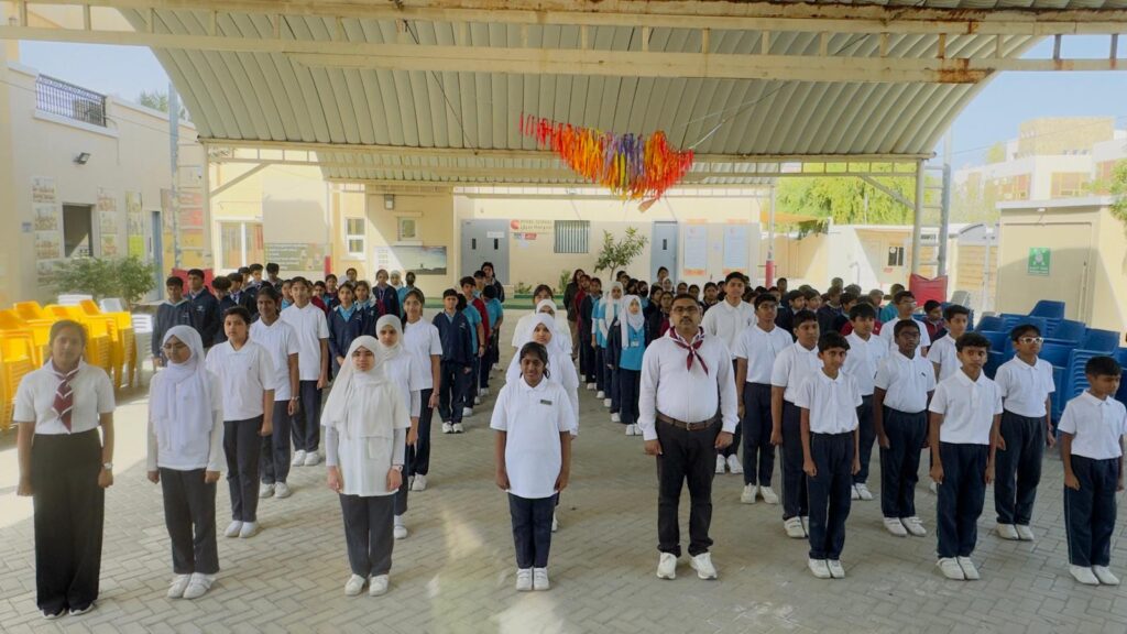 Grade 7 and 8 students receiving badges during Qatar Scouts & Guides Badging Ceremony