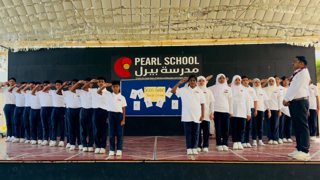 Students performing Scouts Salute at Pearl School Al Dafna Campus