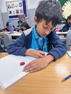 Students Participating in Tamil Handwriting Competition