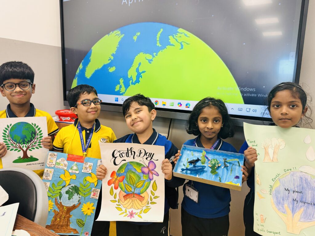 Grade 2 students presenting ideas during Earth Day Activity by grade 1-2