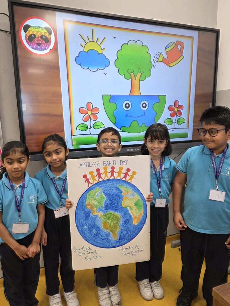 Students showcasing eco-friendly models during Earth Day Activity by grade 1-2