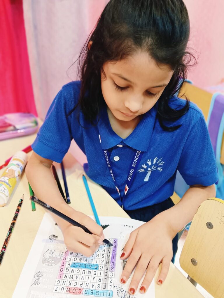 Children engaged in word search activity on World Heritage Day at Pearl School, Al Dafna Campus