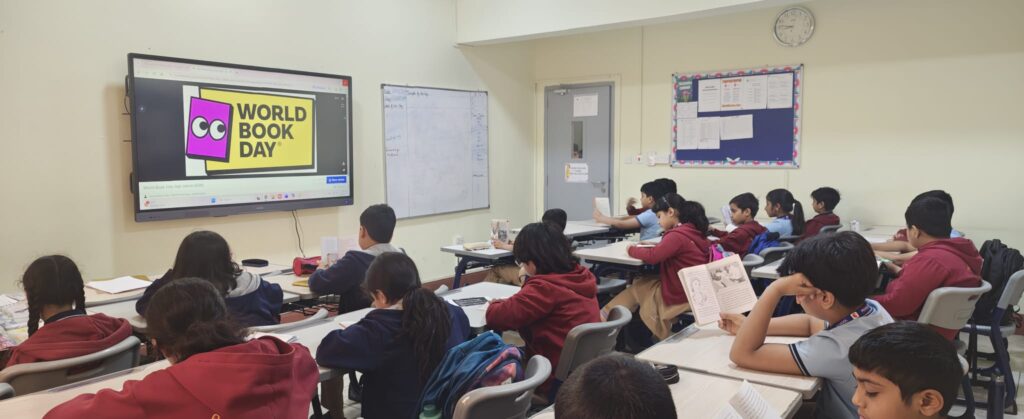 Students reading books during World Book Day Reading Hour at Pearl School