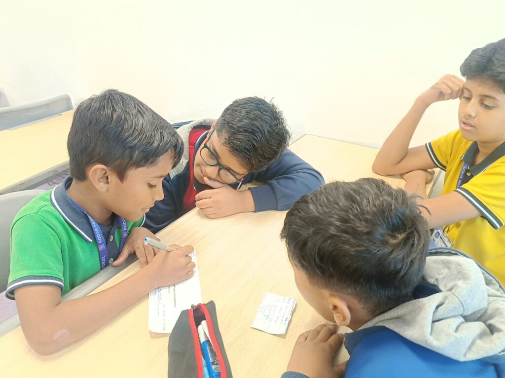 Labour Day activity by Grade 3–5 showing teamwork and group problem solving