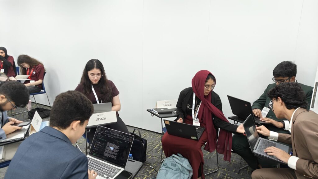 Student delegates in discussion at Lycée Franco Qatarien Voltaire (VolMUN 2026) Model United Nations
