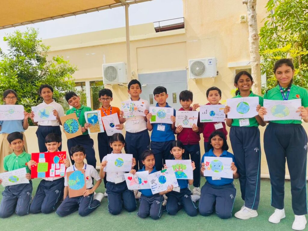 Creative Earth Day poster and craft activity by students promoting eco-friendly habits